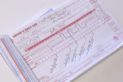 Completed driver's daily log form with handwritten entries tracking hours and vehicle information