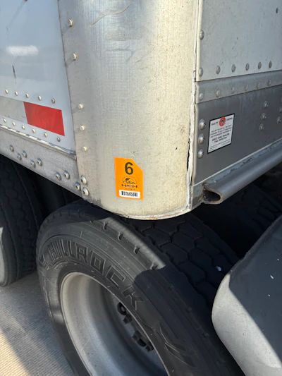 Owner-operator Rios's truck and trailer emerged from a recent Missouri inspection with CVSA clean-inspection stickers on both, yet he got dinged for a worn-out Illinois plate that's been through the ringer, that's sure, with the owner's long tenure leased there.
