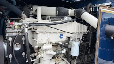 Cummins diesel engine with turbocharger and fuel filter system mounted in industrial equipment