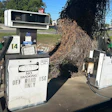 Vintage gas pumps numbered 14 with 'No Smoking' signage in outdoor setting