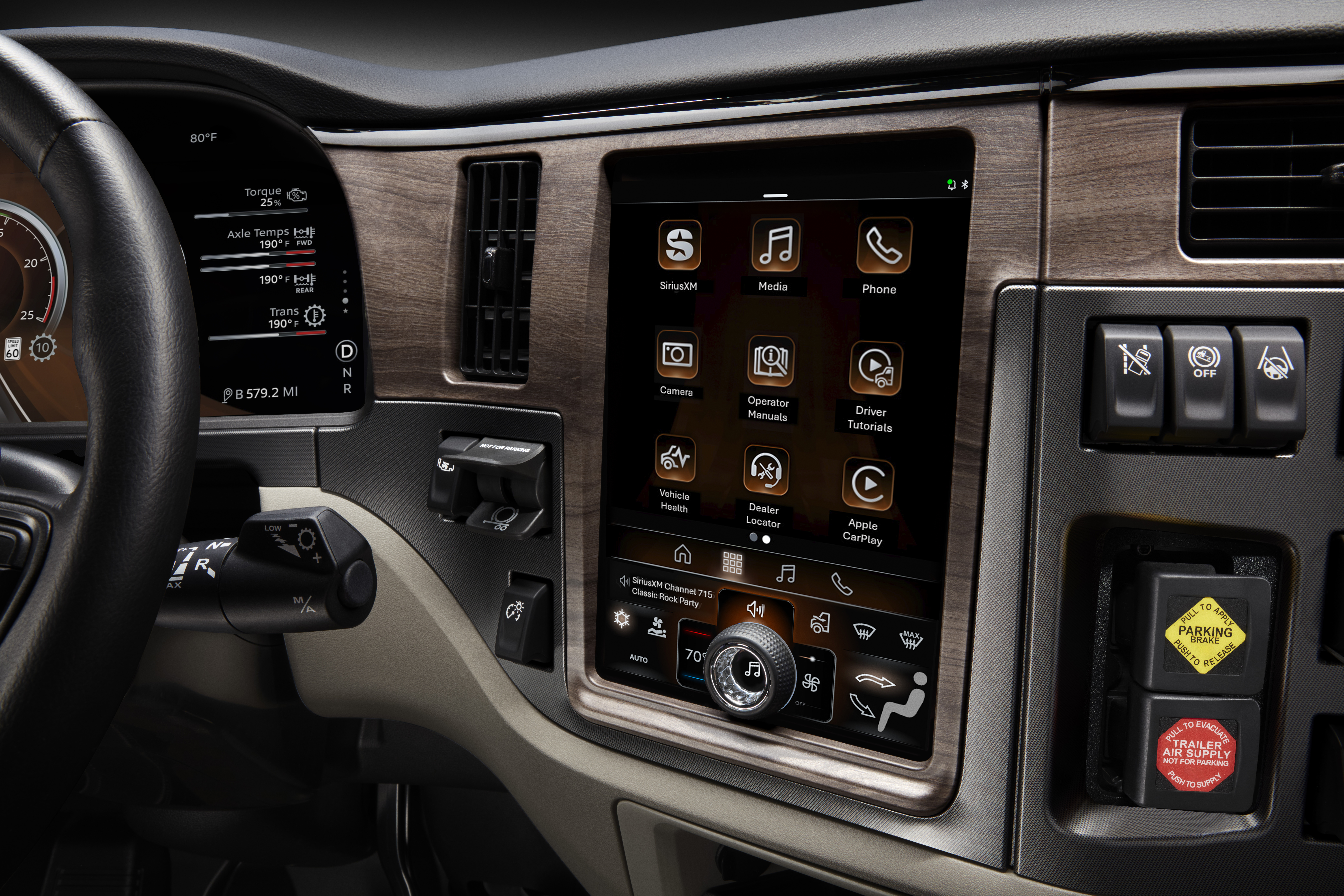 Modern vehicle dashboard with touchscreen infotainment system displaying app icons and controls